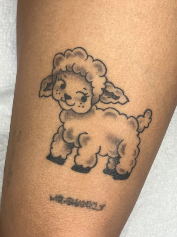 Adorable minimalist lamb tattoo