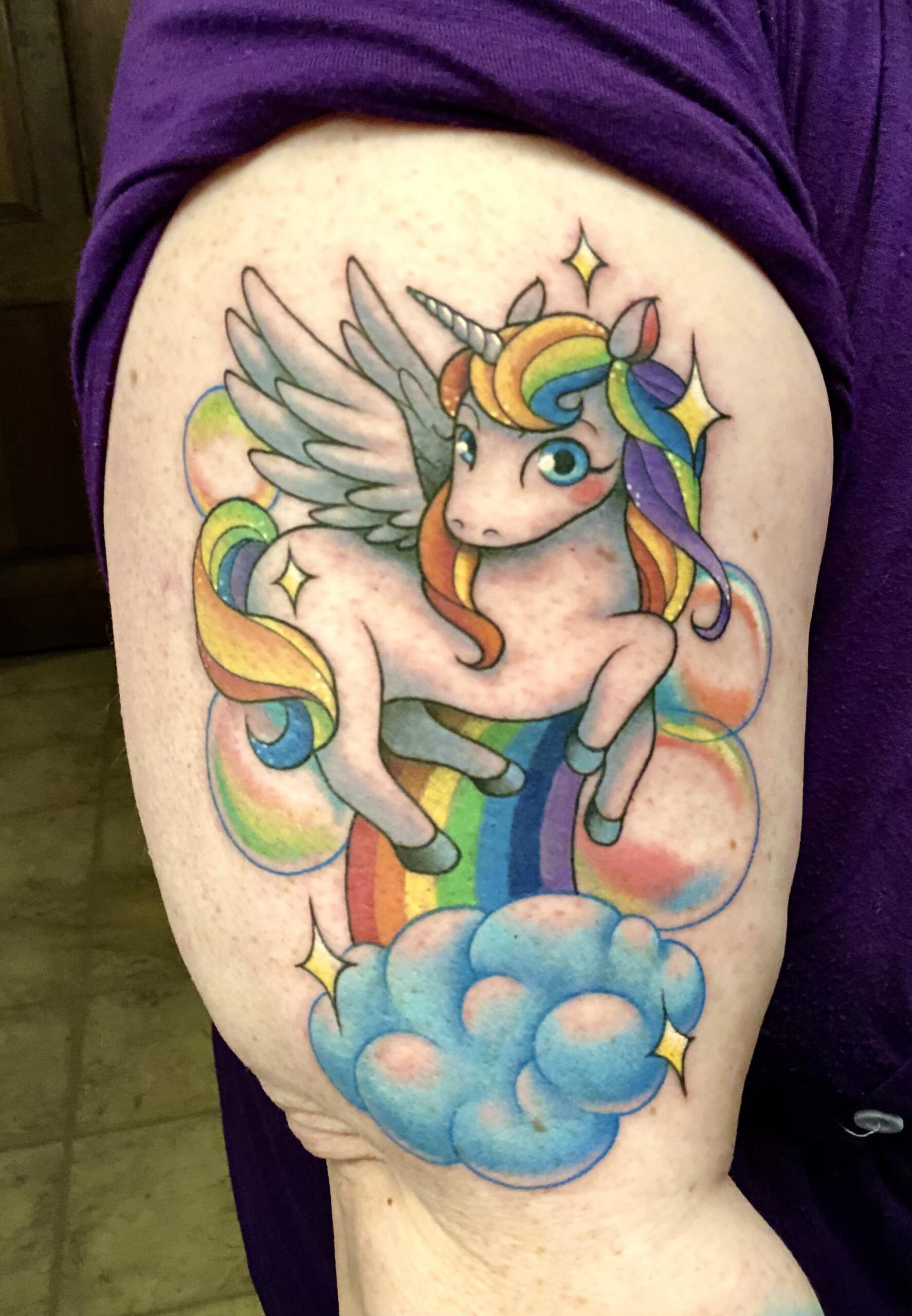 Vibrant Rainbow Unicorn Tattoo Art