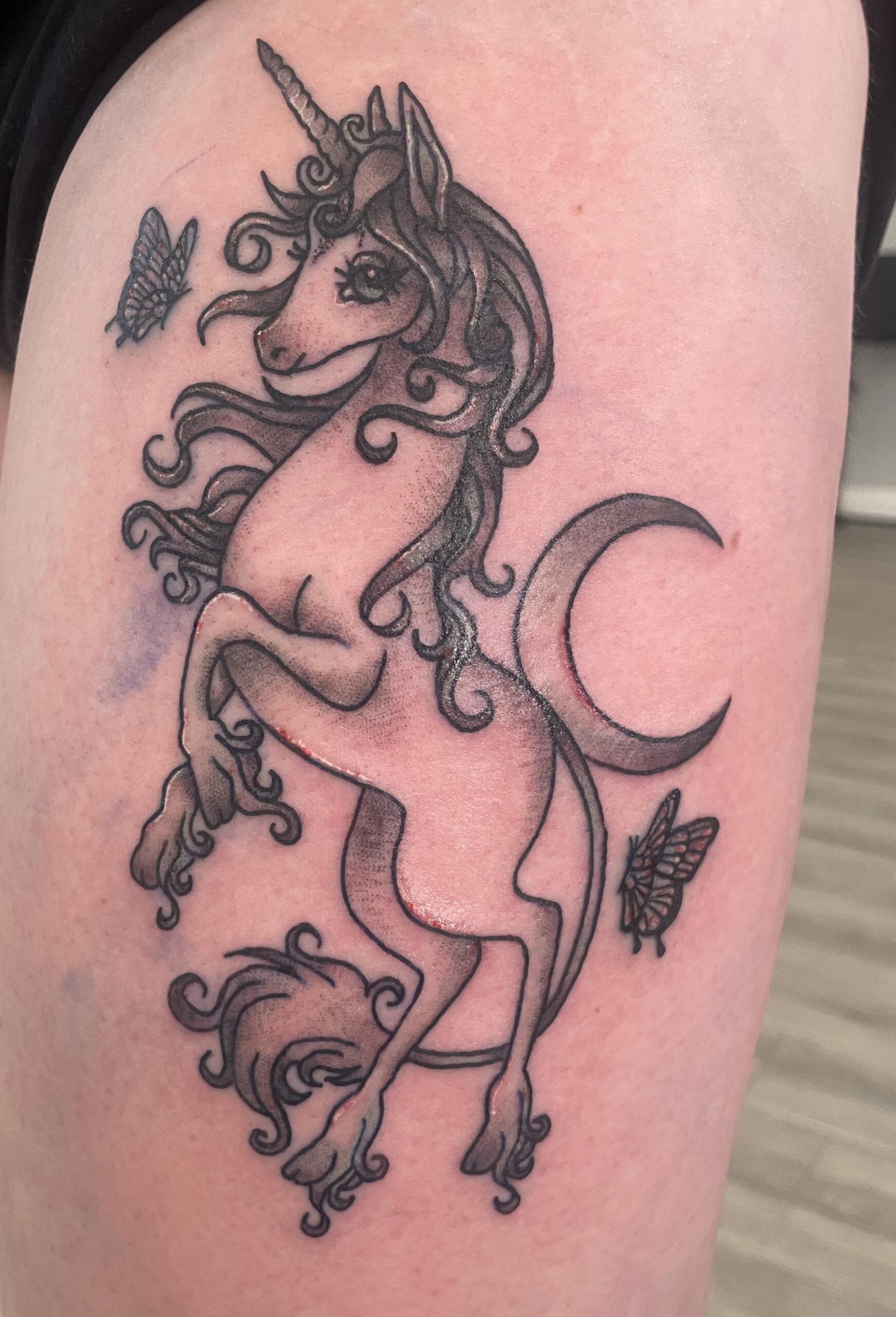 Minimalist Black and Grey Unicorn Tattoo