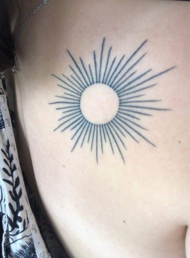 Elegant Fine Line Sun Tattoo