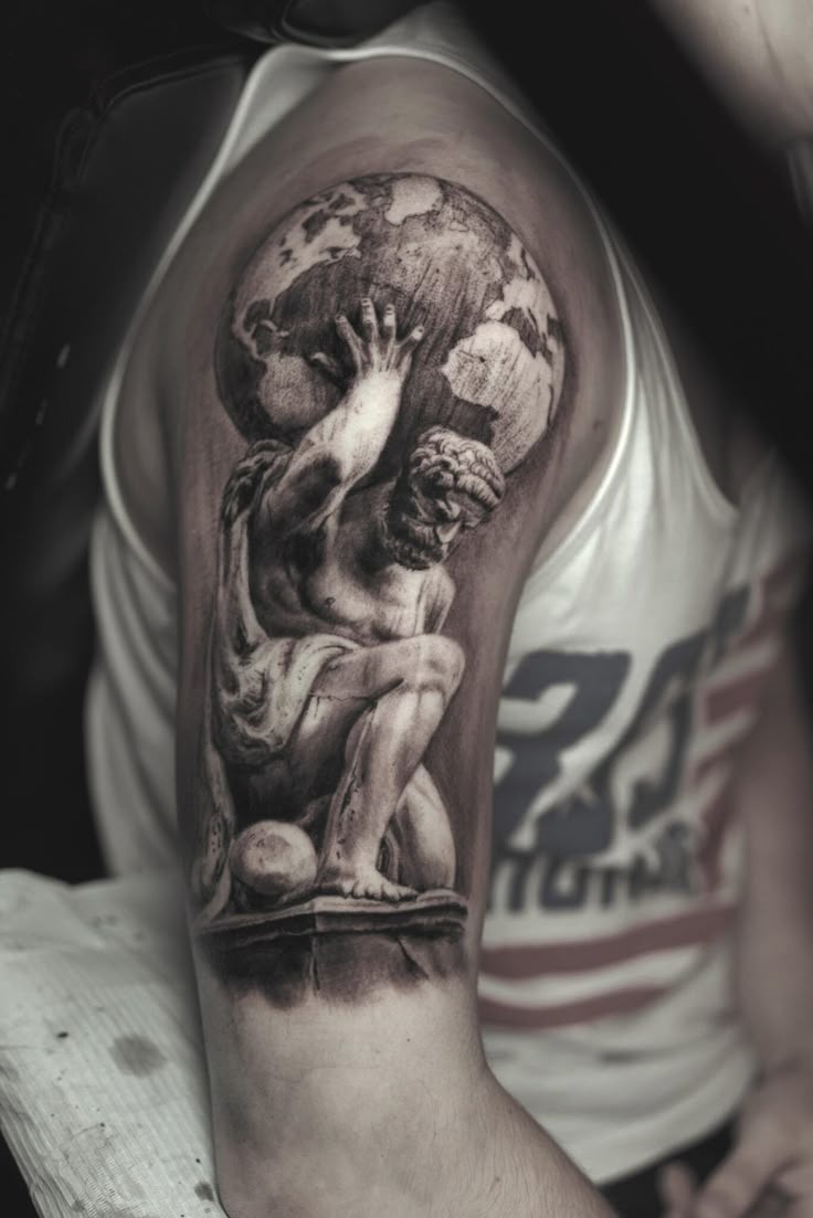 Powerful Atlas Themed Shoulder Tattoo