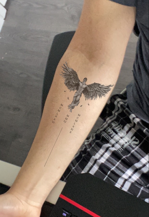 Minimalist Icarus-inspired forearm tattoo