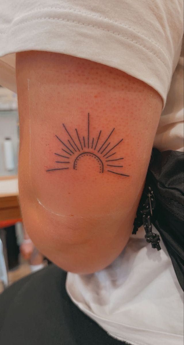 Simple Line-Art Sun Tattoo