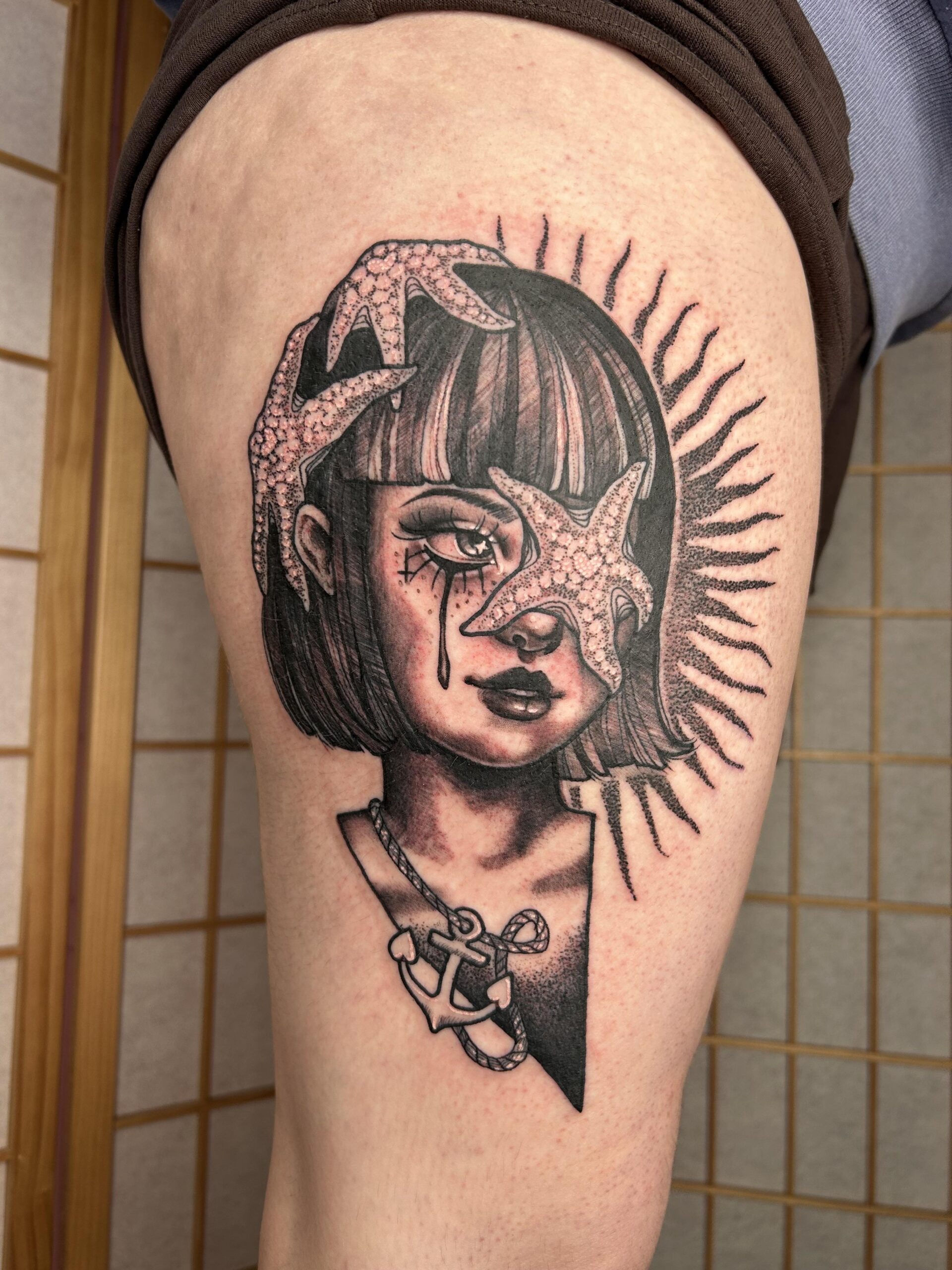 Nautical-Themed Sun Portrait Tattoo