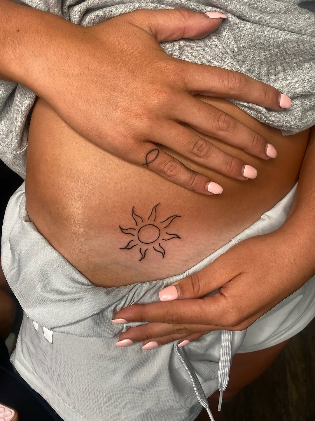 Stylish waist sun tattoo