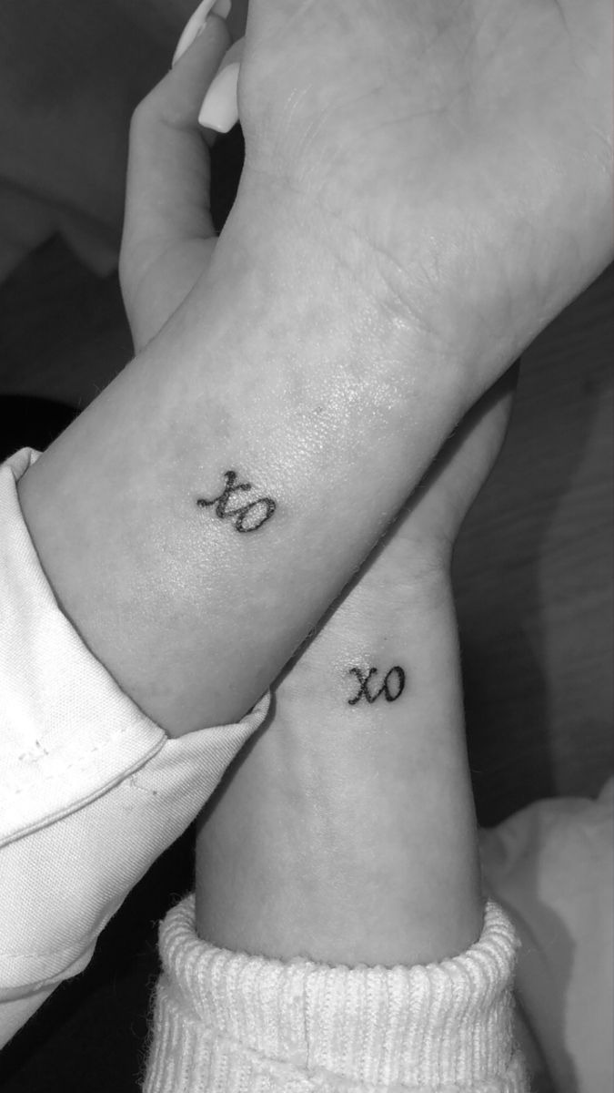 Minimalist matching wrist tattoos