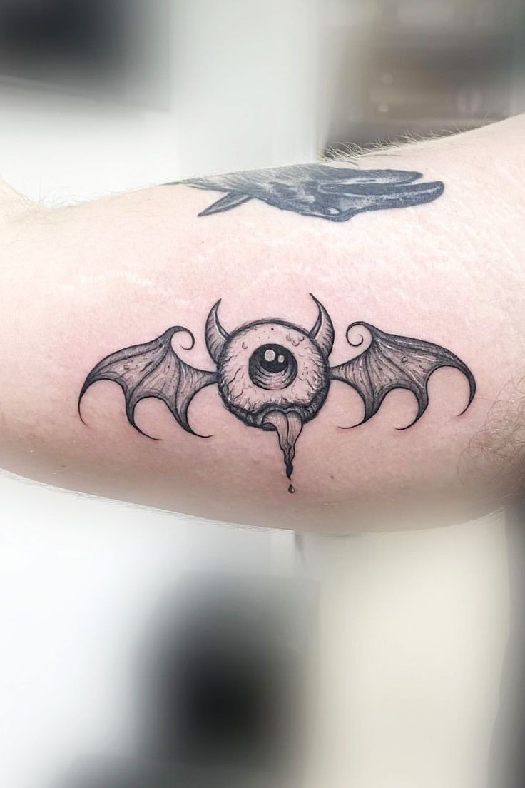 Creative Bat Wing Eye Tattoo Design