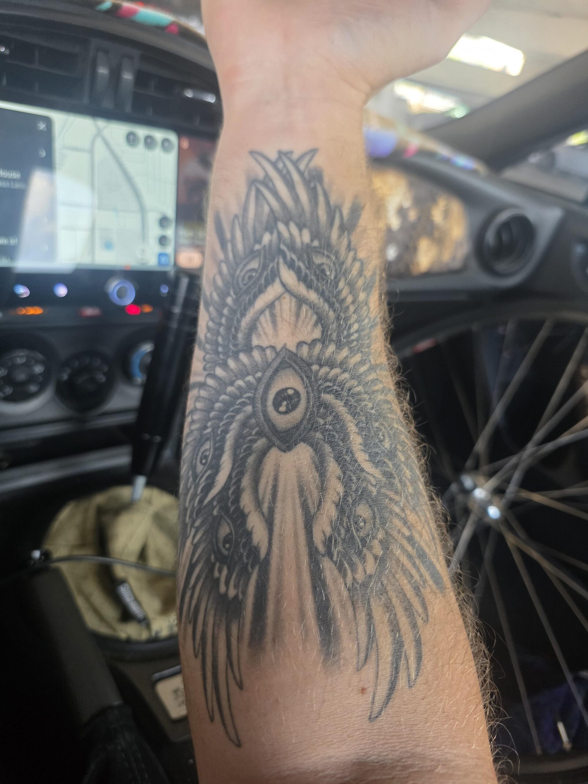 Intricate Wing and Eye Tattoo Work