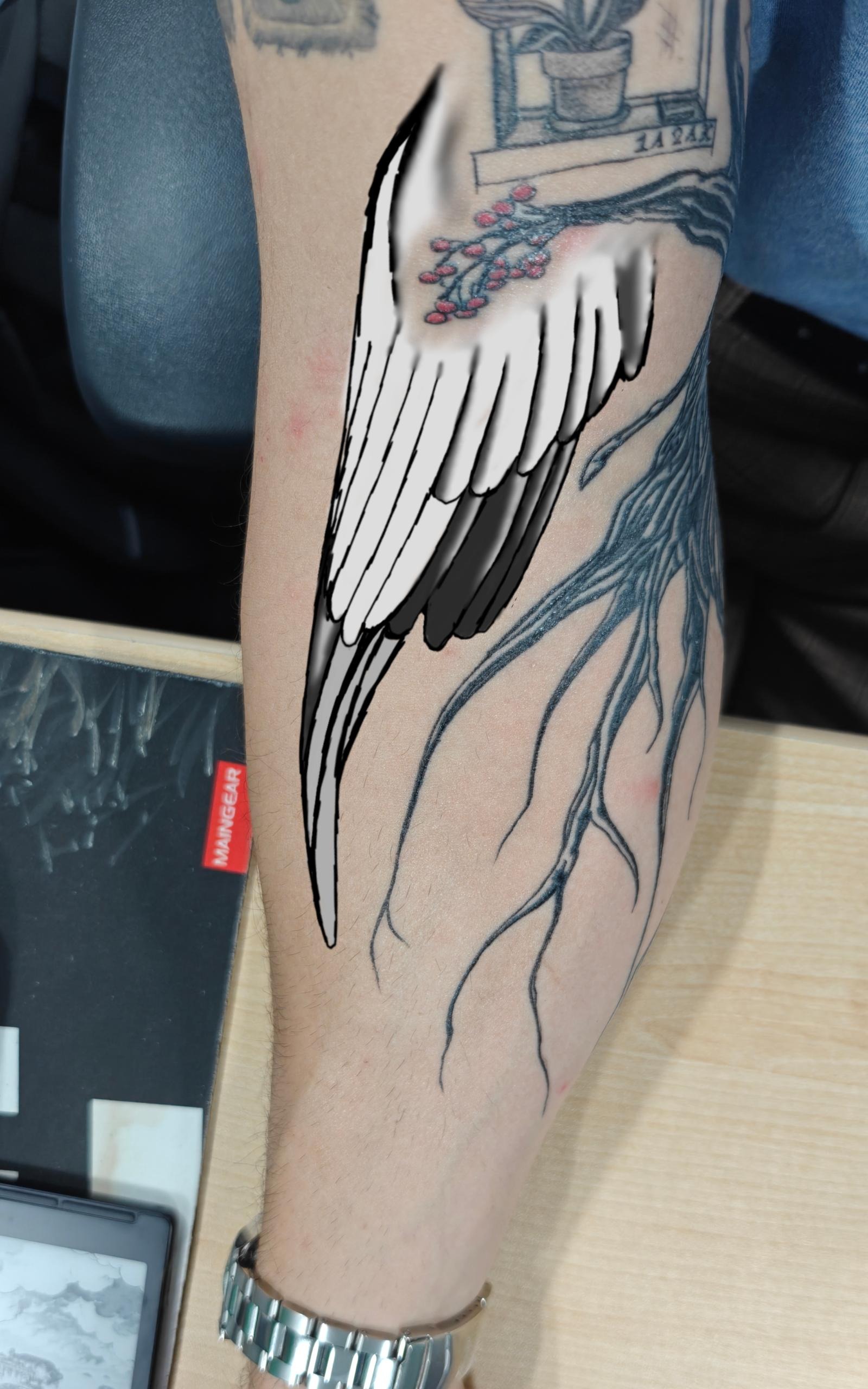 Elegant Minimalist Wing Tattoo