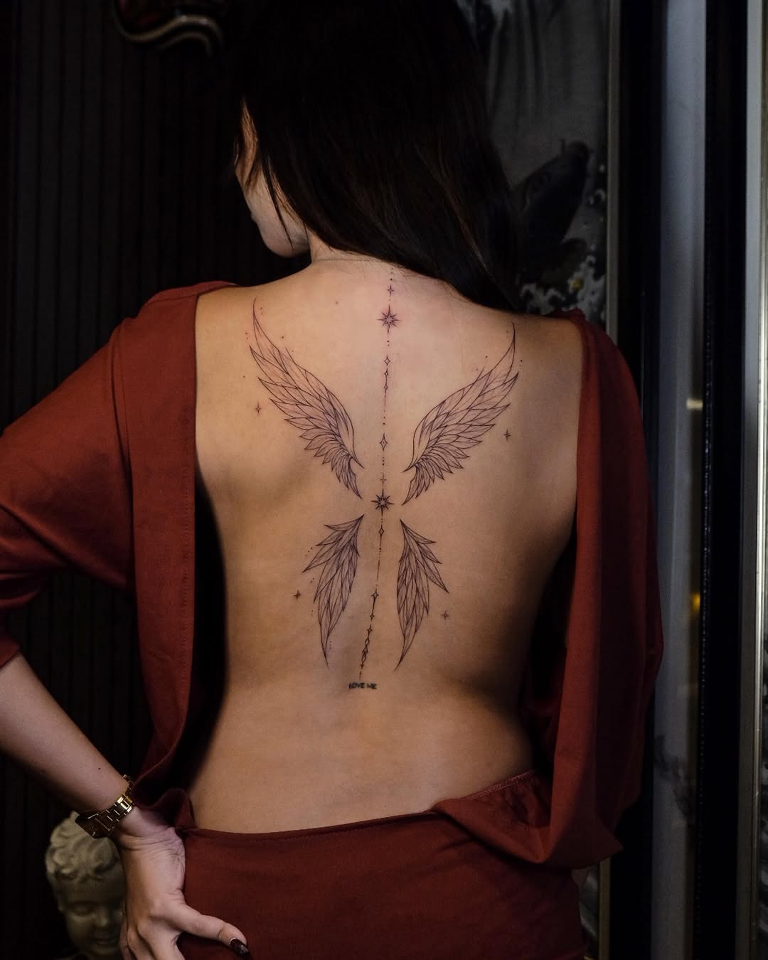 Delicate Fine-Line Wing Tattoo