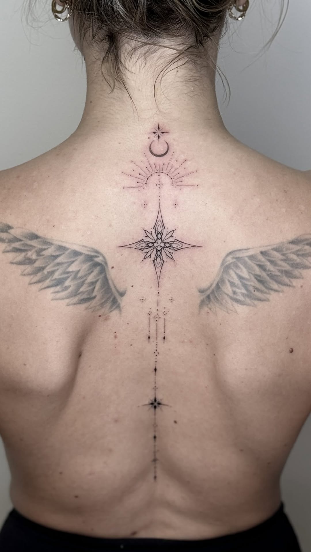 Intricate Spinal Back Wing Tattoo