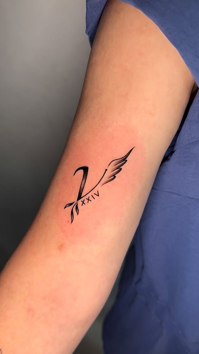 Minimalist Roman Numeral Wing Tattoo