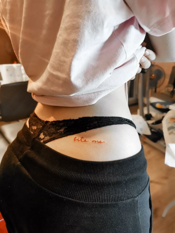 Dainty cursive bite me hip ink