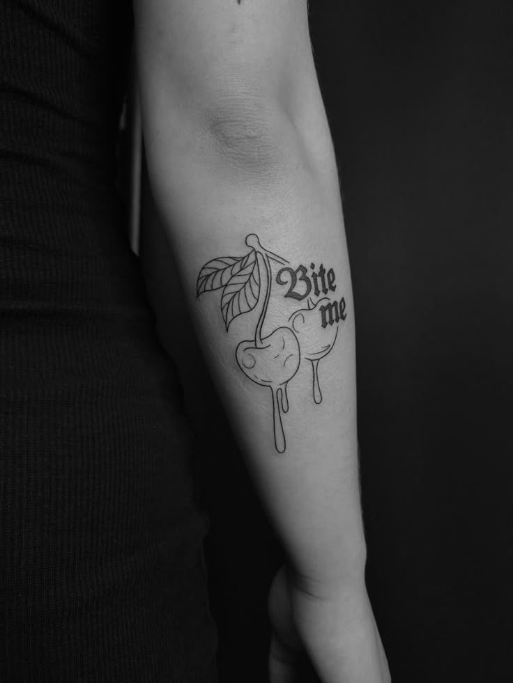 Creative cherry bite me arm tattoo
