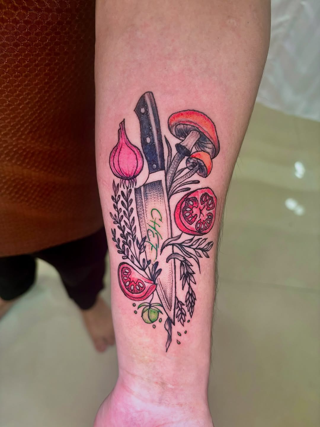 Colorful culinary ingredient and knife tattoo
