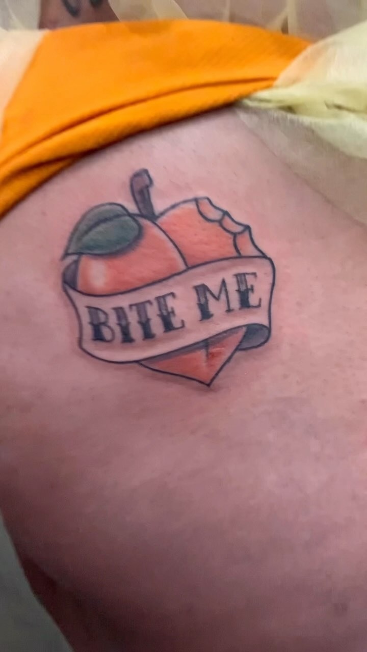 Whimsical Peach 'Bite Me' Tattoo