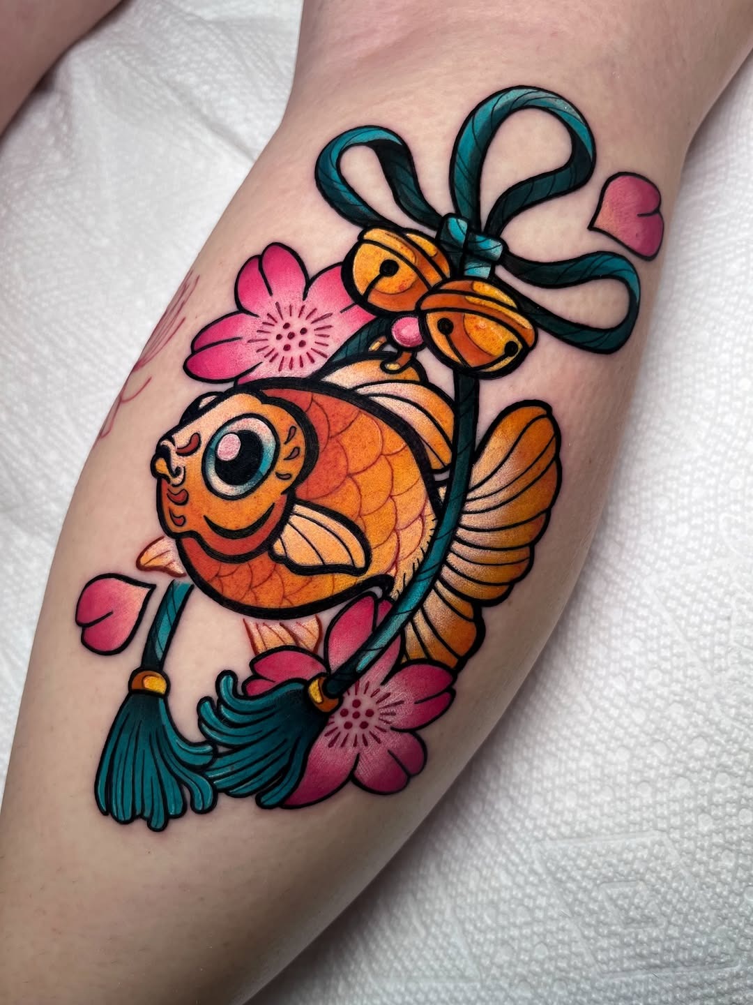 Colorful Japanese-inspired fish tattoo art