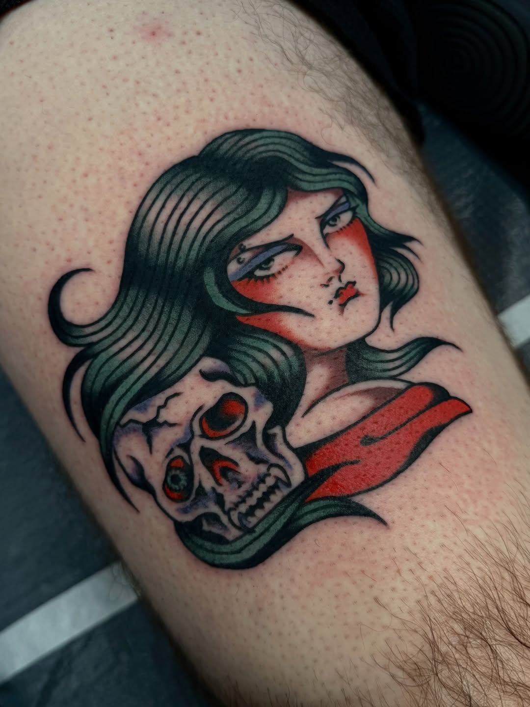 Classic traditional tattoo flash featuring a woman and skull