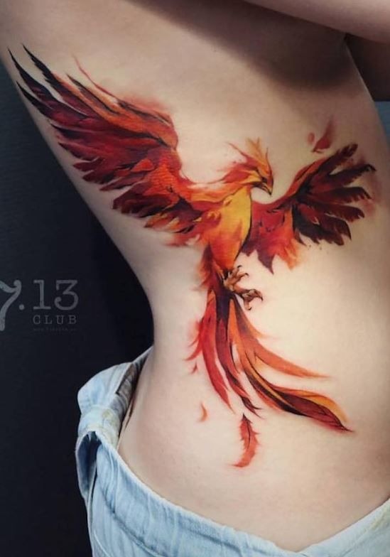 Stunning vibrant side-rib phoenix tattoo