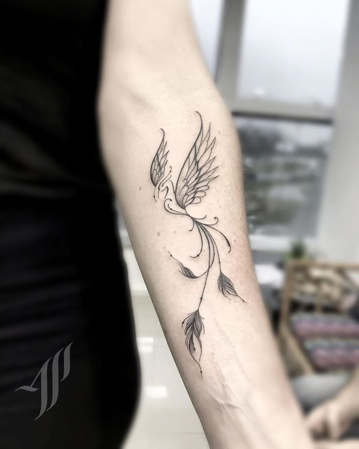 Delicate fine-line phoenix tattoo