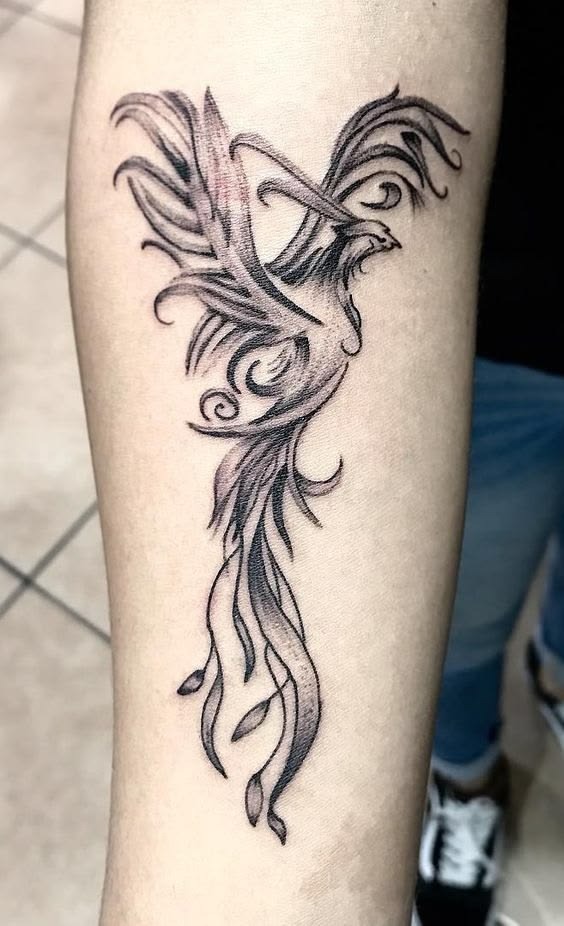 Classic black and grey phoenix tattoo