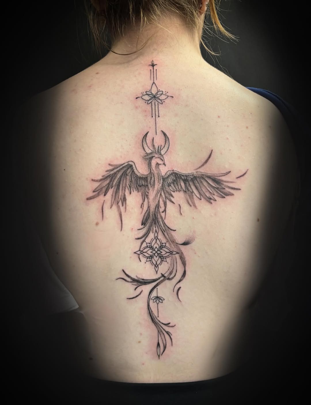 Detailed Spinal Phoenix Tattoo Art