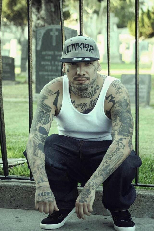 Edgy Cemetery Portrait Featuring Traditional Tattoos