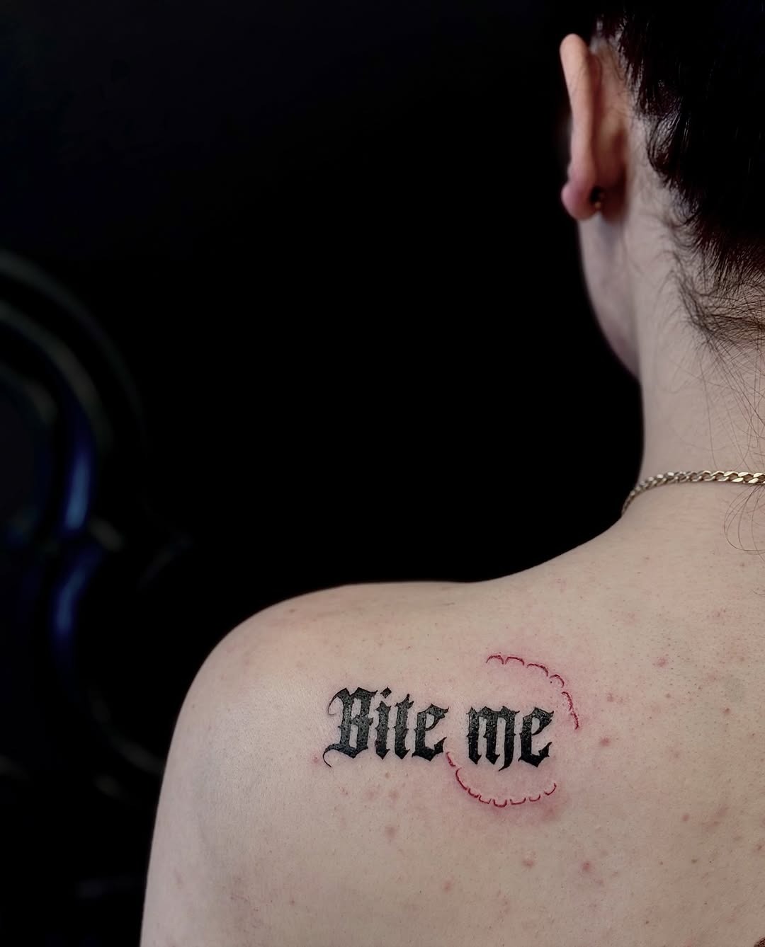 Bold Gothic Script Shoulder Tattoo