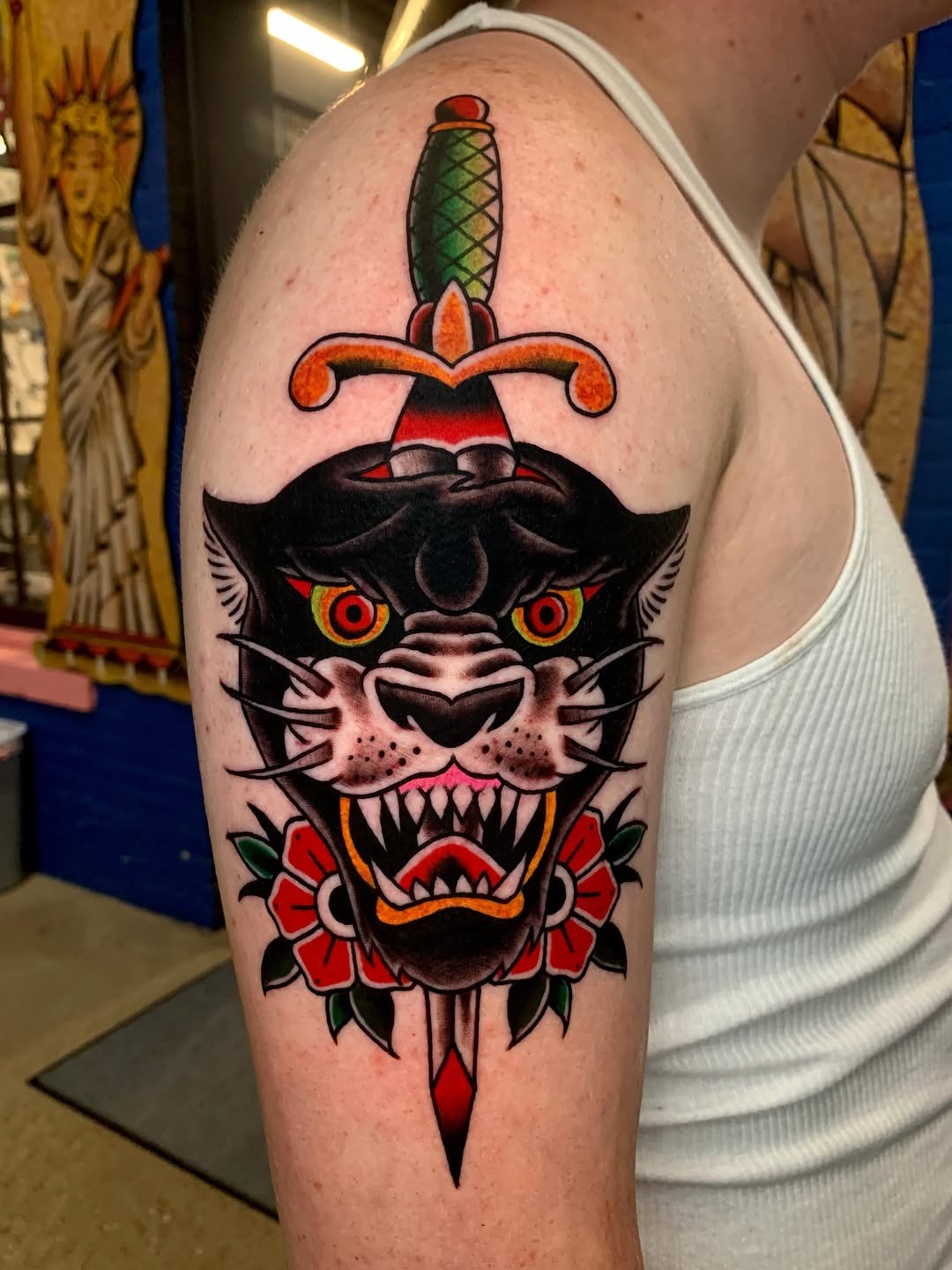Bold Traditional Panther Arm Tattoo