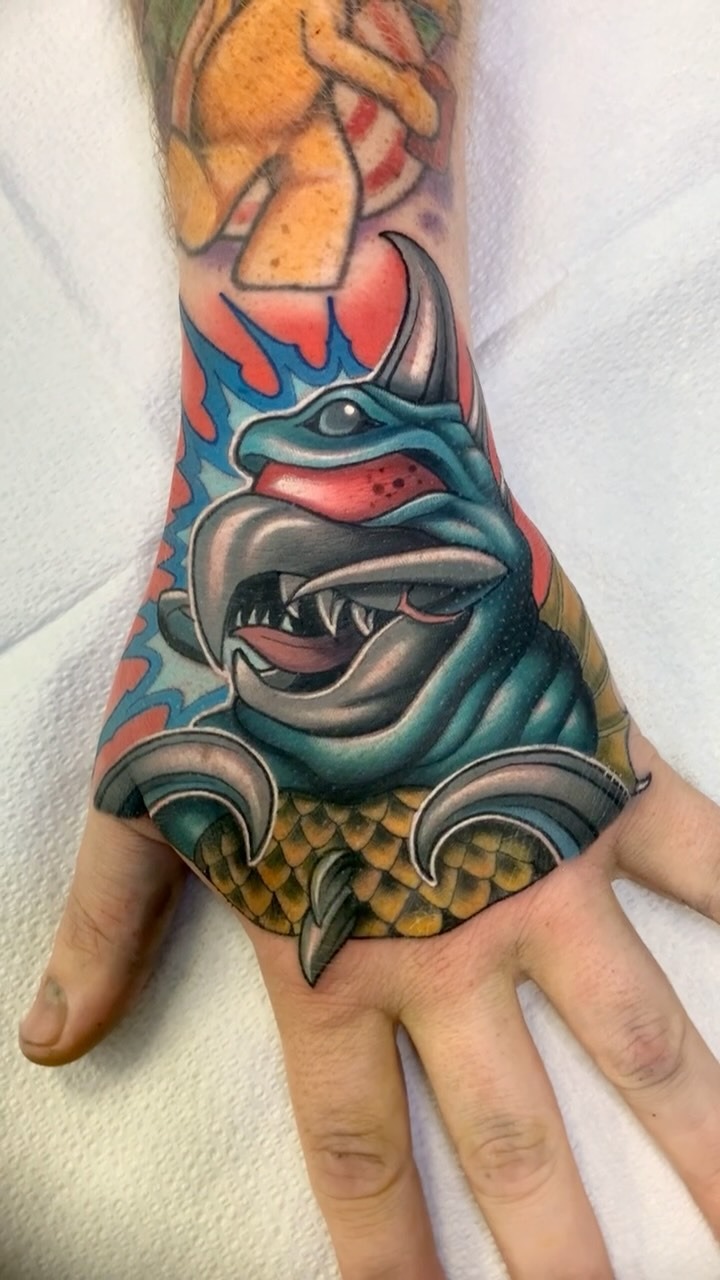 Vibrant Traditional Mutant Hand Tattoo