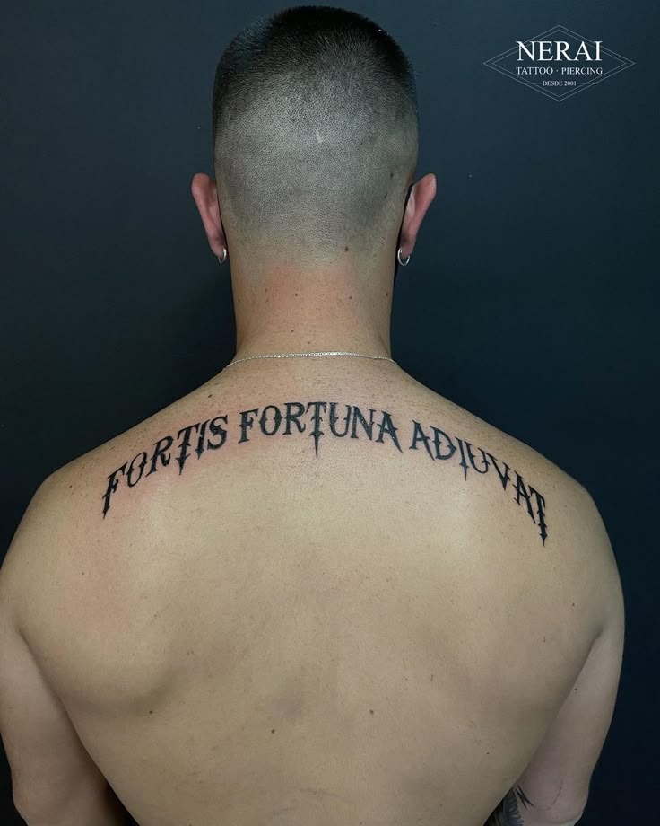 Bold Upper Back Text Tattoo