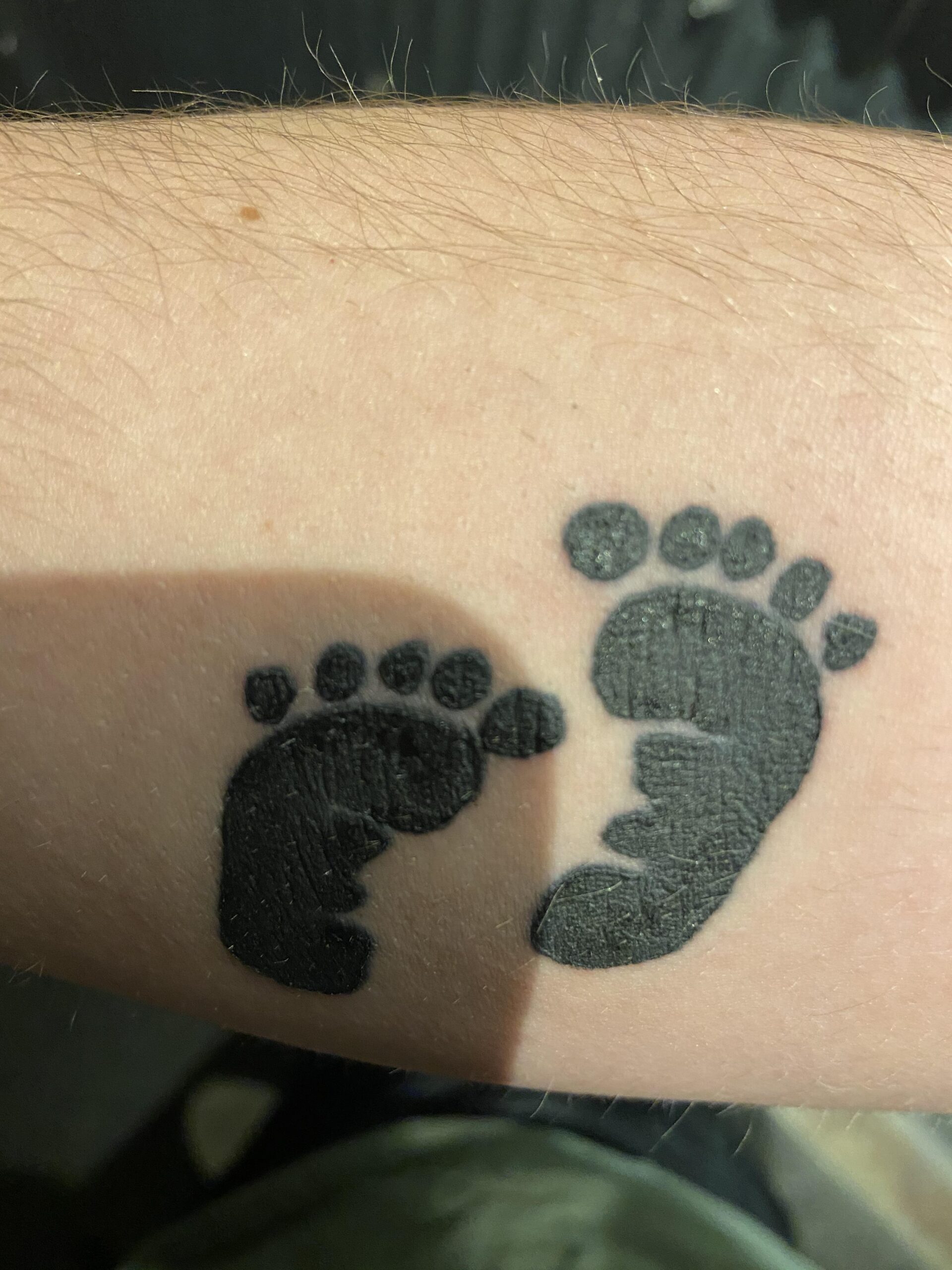 Simple Black Ink Baby Footprint Tattoo