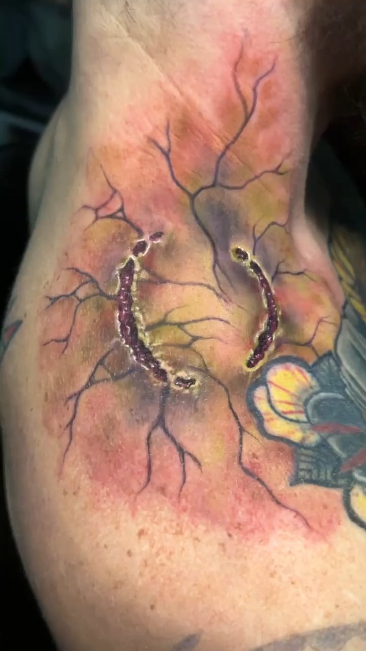 Realistic bite mark tattoo art