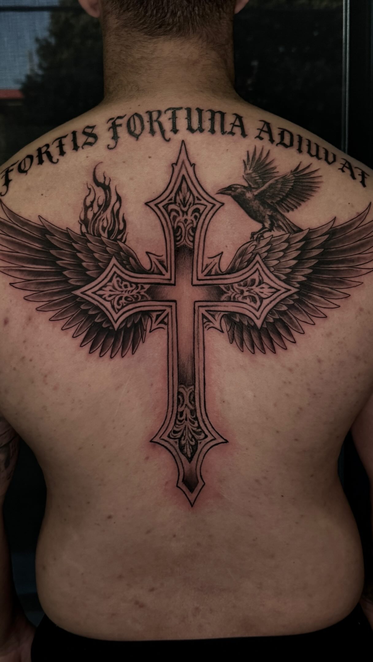Intricate Winged Cross Back Design