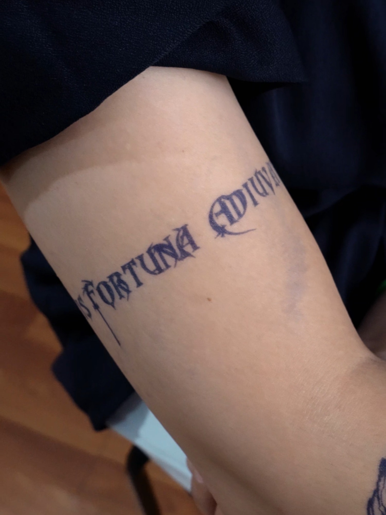 Minimalist Script Bicep Tattoo