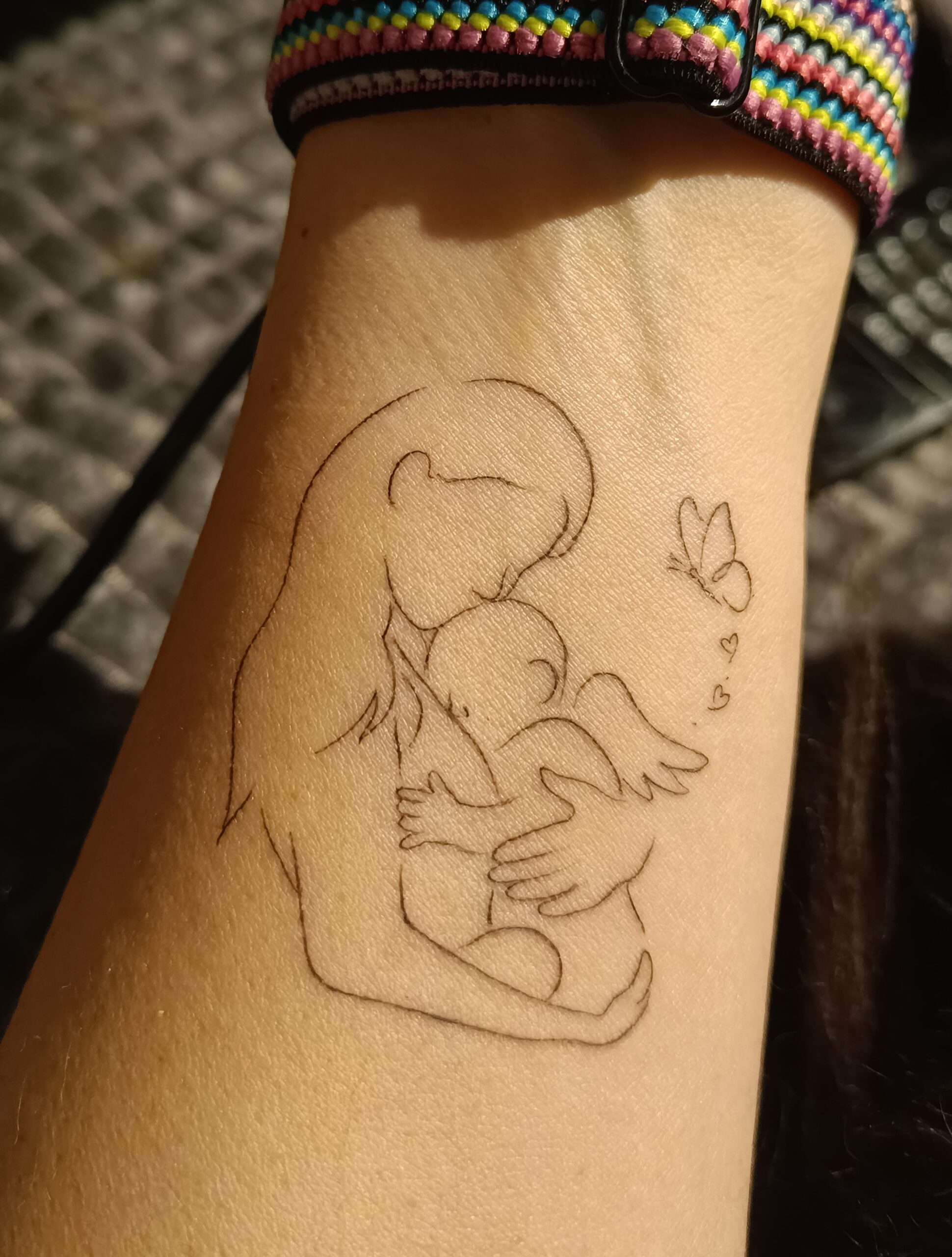 Gentle line art memorial tattoo