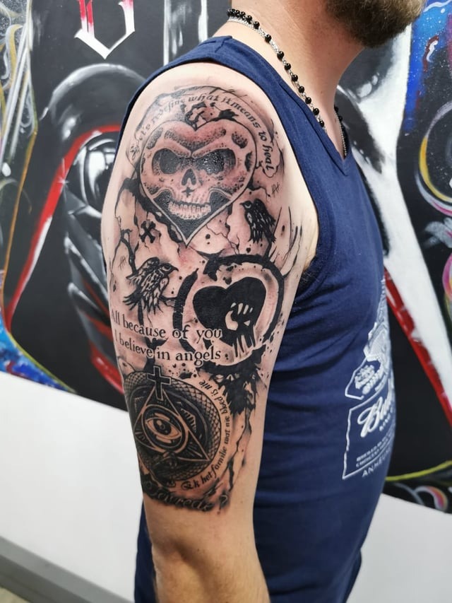 Intricate Rock-Inspired Half Sleeve Tattoo
