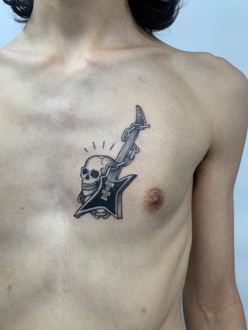 Edgy Skull and Electric Guitar Chest Piece