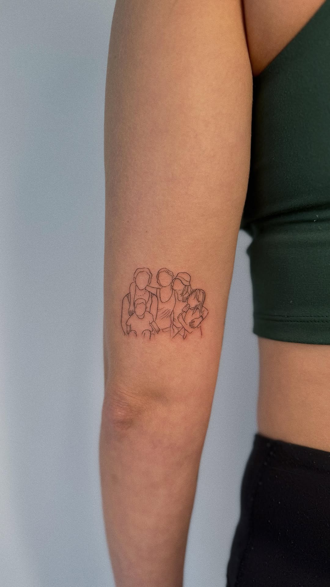 Minimalist Family Portrait Arm Tattoo