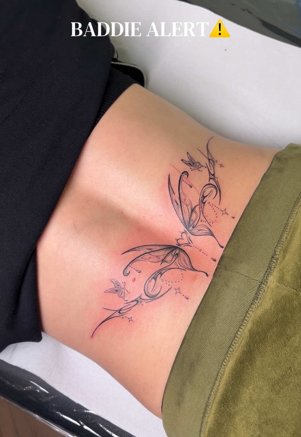 Intricate Butterfly Lower Back Tattoo