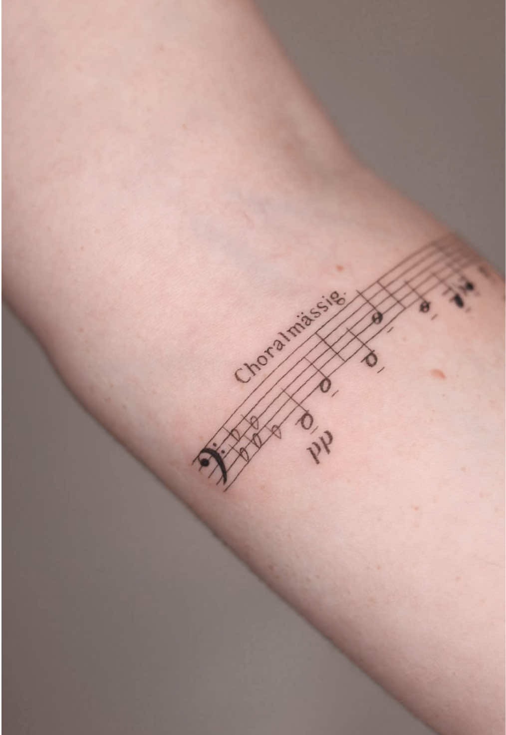 Elegant Minimalist Musical Staff Tattoo