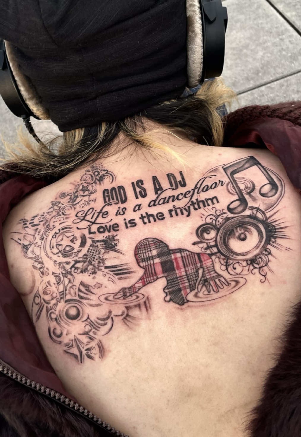 Intricate Music and Rhythm-Themed Back Tattoo