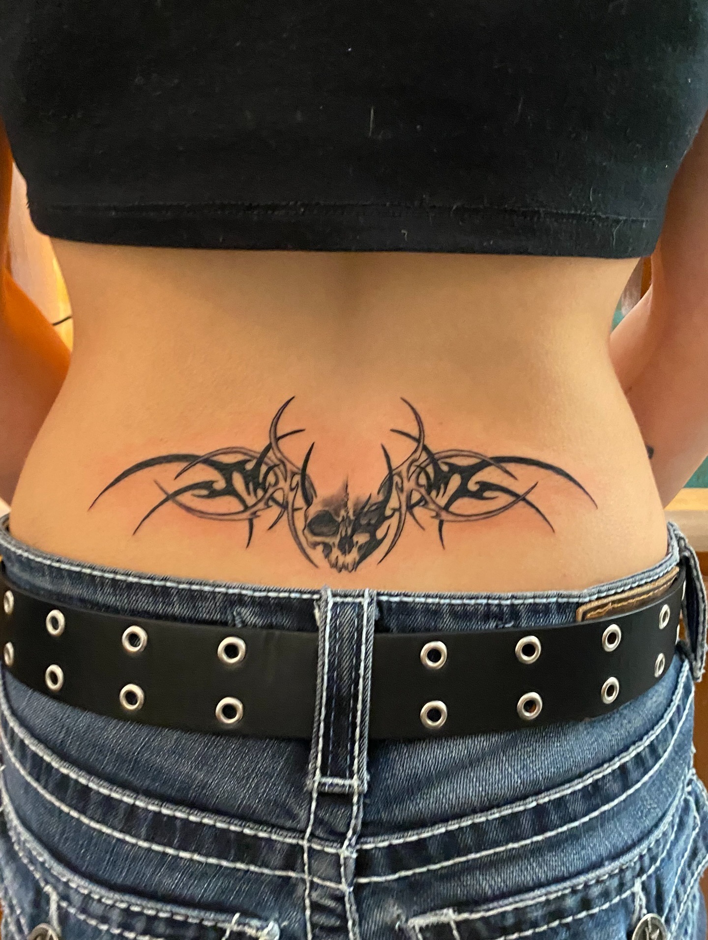 Y2K Inspired Tribal Lower Back Tattoo