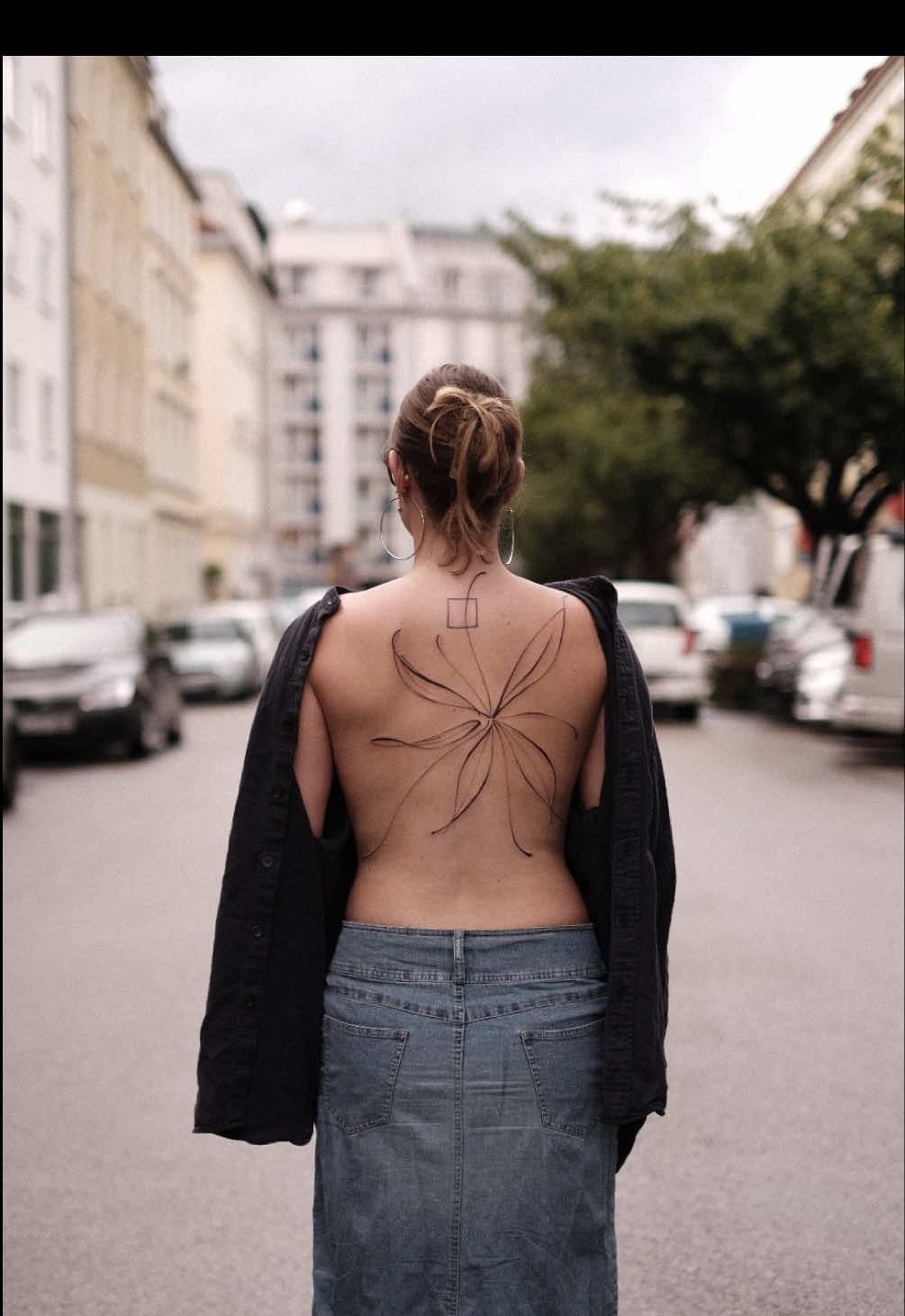 Minimalist fine-line back tattoo inspiration