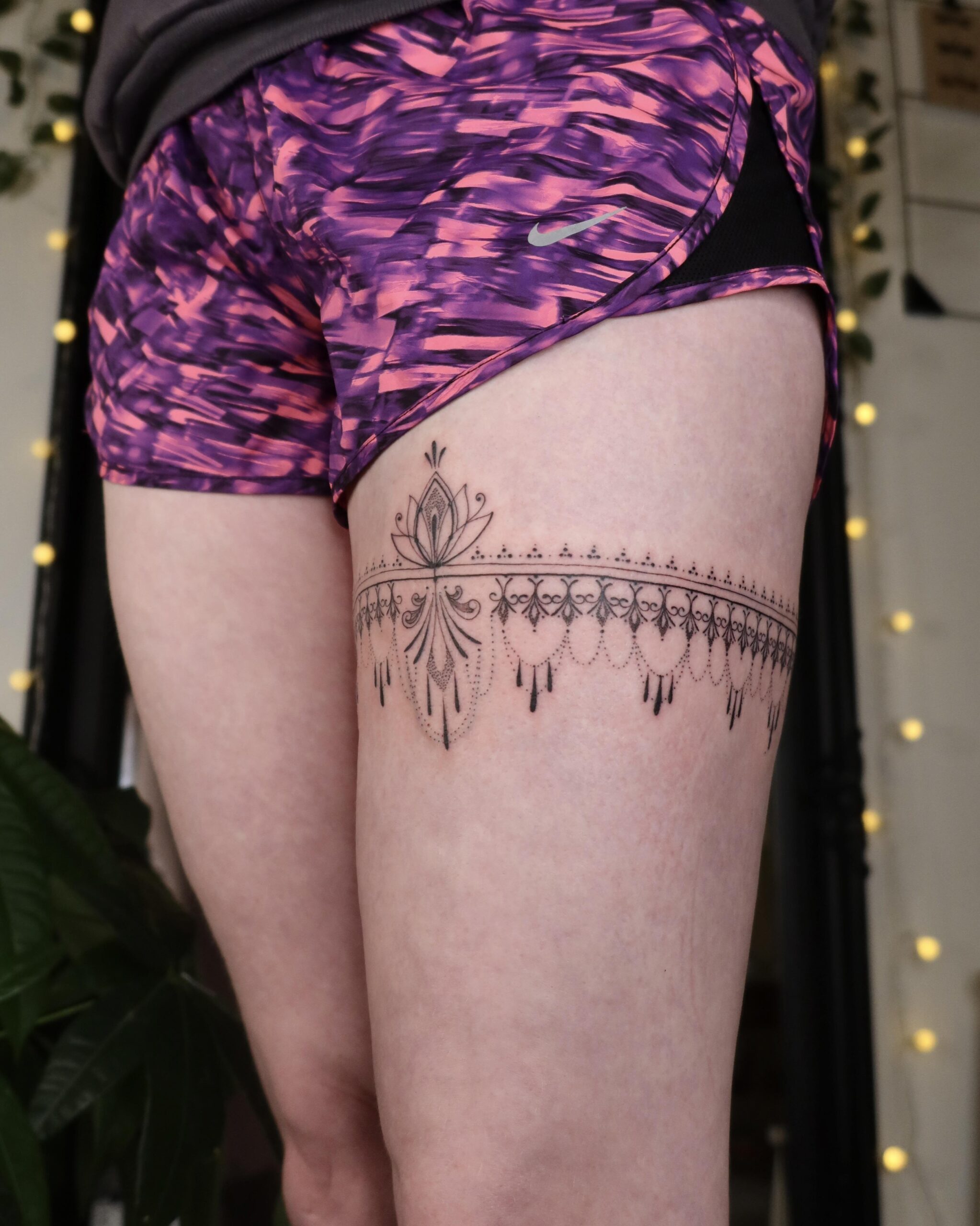 Elegant ornamental garter tattoo
