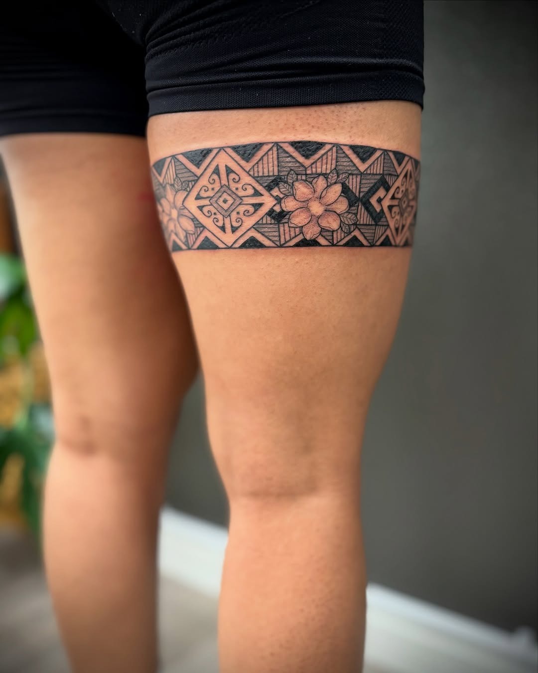 Intricate geometric band tattoo
