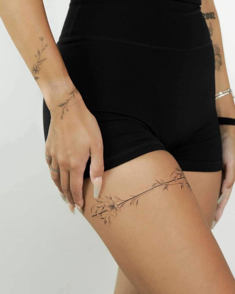 Minimalist Fine Line Thigh Tattoo