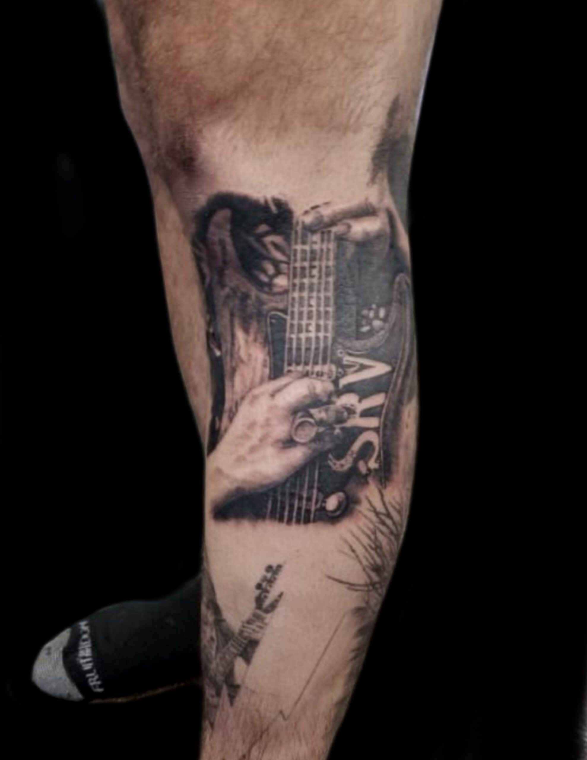 Detailed Musician Tribute Guitar Tattoo