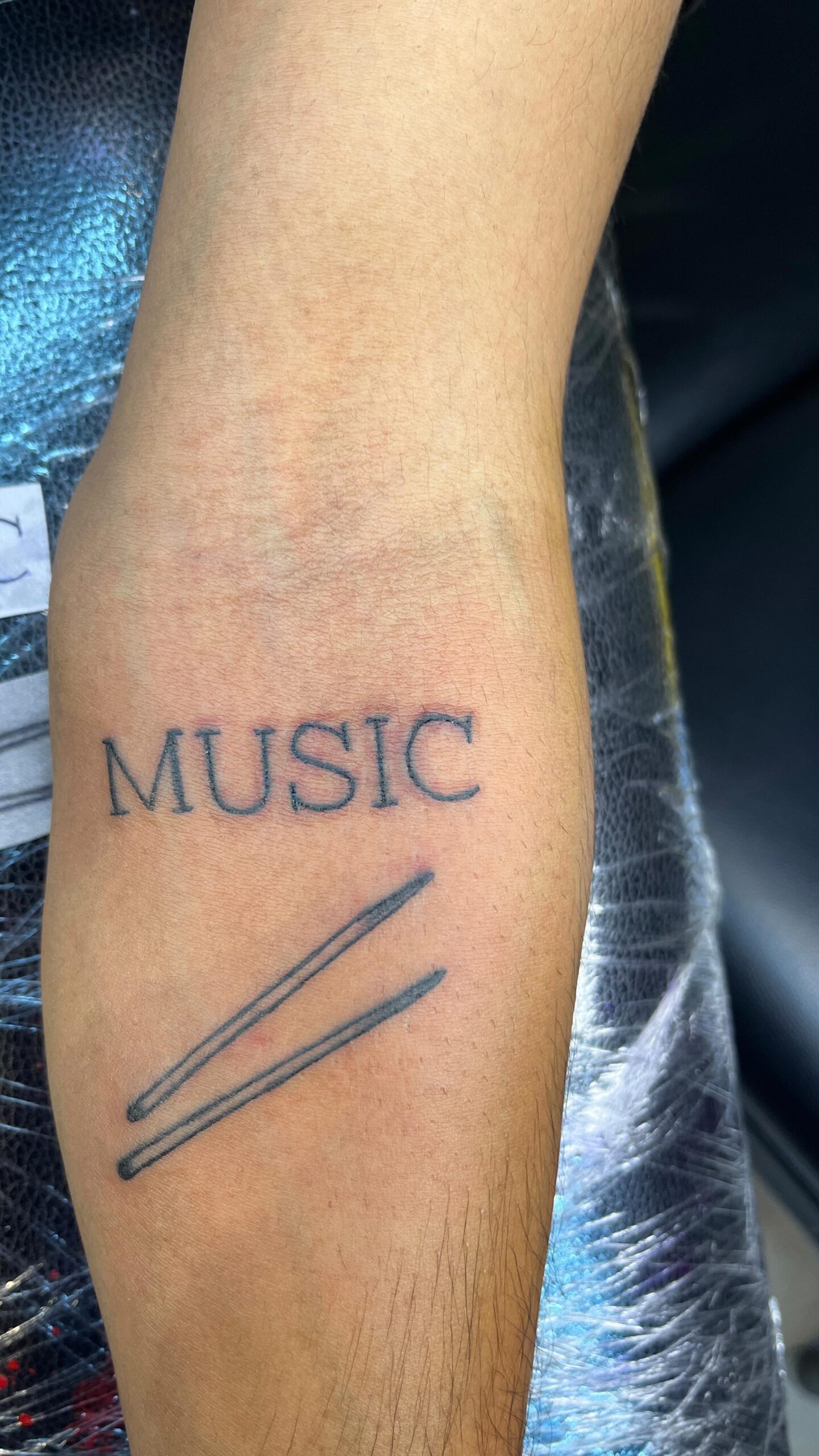 Simple Drumstick Music Tattoo