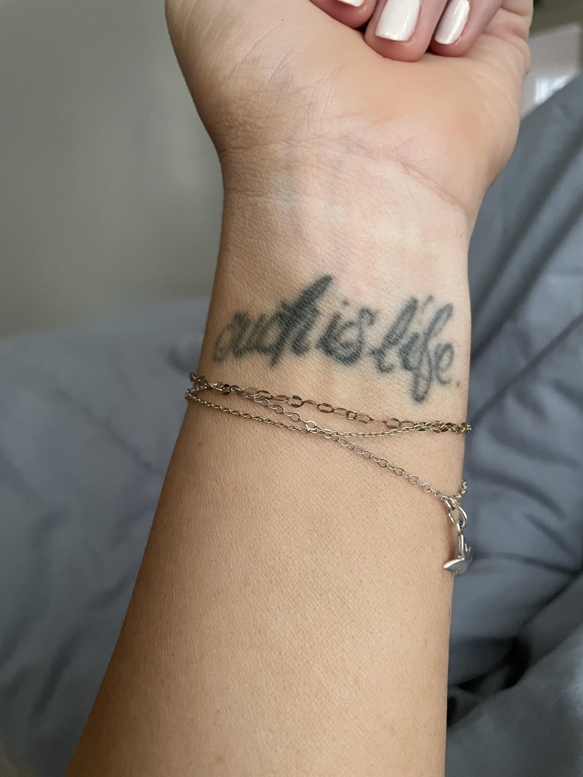 Elegant Script Tattoos for the Wrist